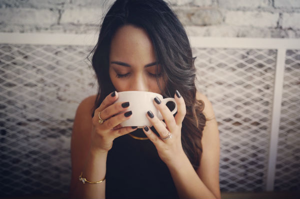 how to reduce anxiety woman drinking tea