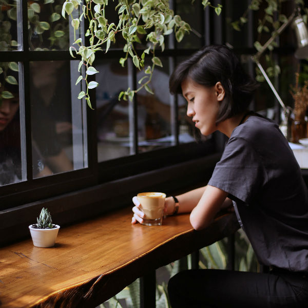 schedule your feelings woman sitting in cafe